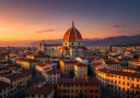 Florence city skyline at sunset with the iconic Duomo cathedral dome glowing in warm golden light